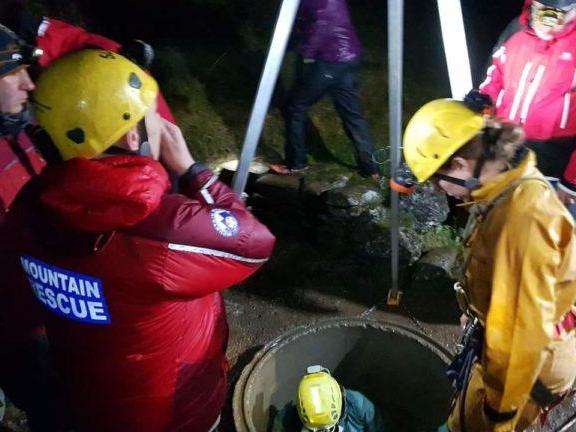 Rescuers descend into the Three Counties cave network to search for the missing man