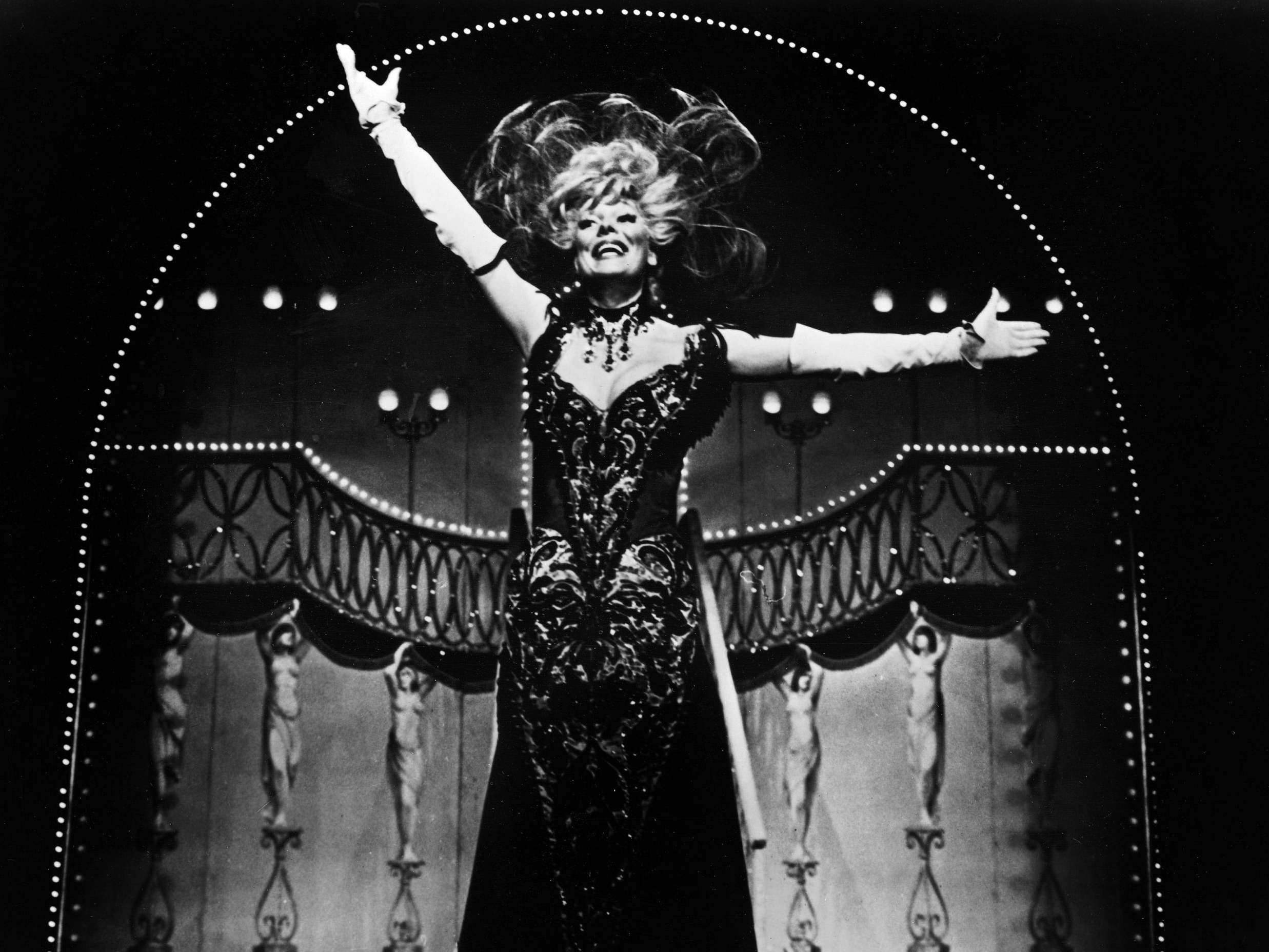 Carol Channing in the title role of Dolly Levi, taking a bow in the 1964 Broadway production