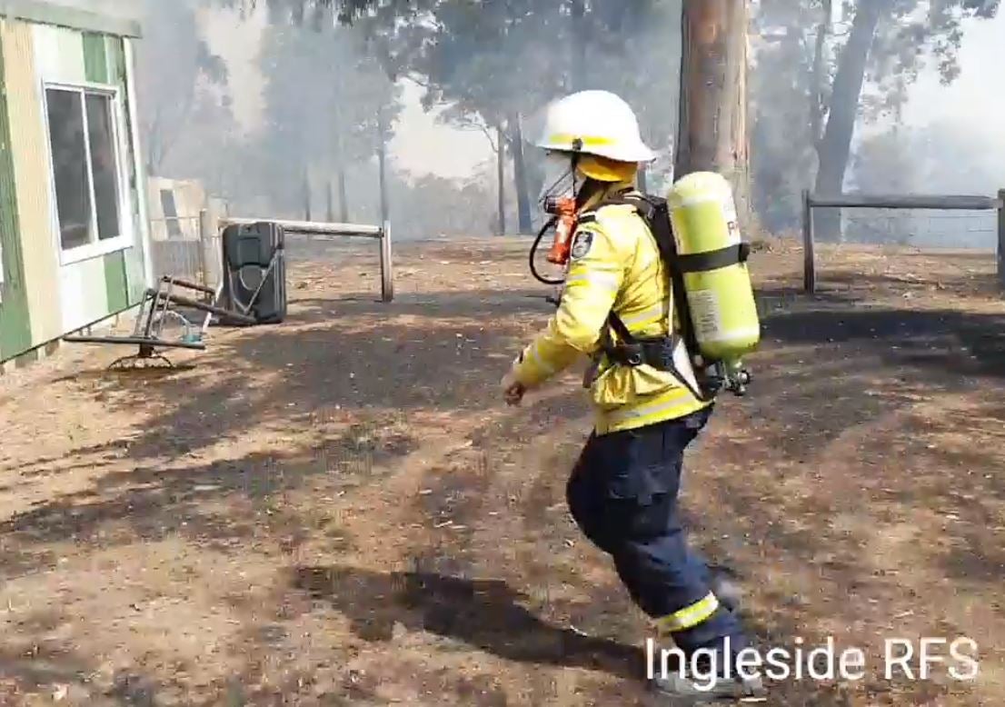 Tony Abbott has been filmed running to extinguish a house fire in Bendalong, New South Wales