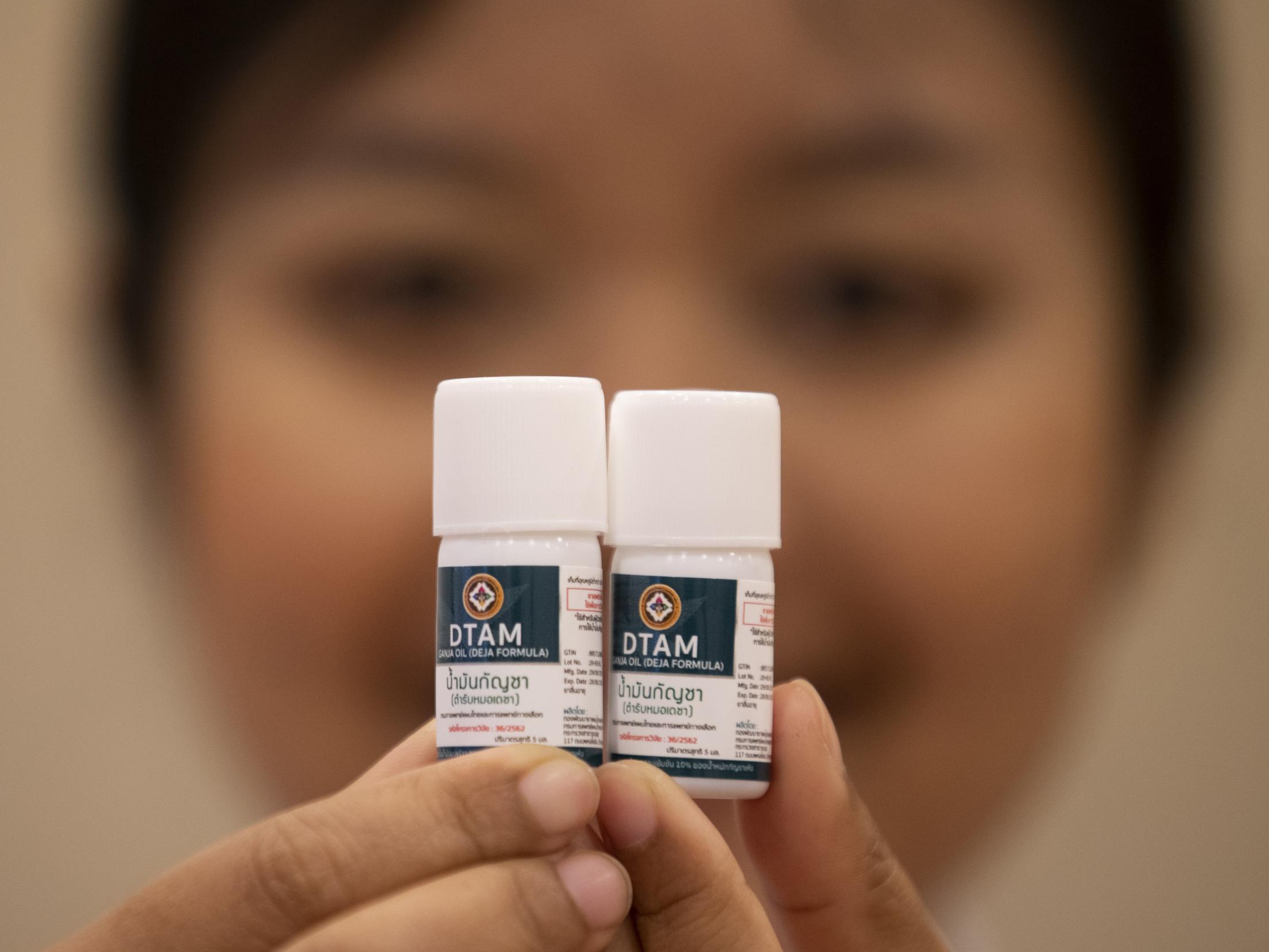 A doctor show containers of cannabis oil at the first full-time clinic prescribing cannabis oil for medical treatment in the Public Health Ministry