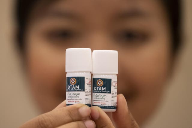 A doctor show containers of cannabis oil at the first full-time clinic prescribing cannabis oil for medical treatment in the Public Health Ministry