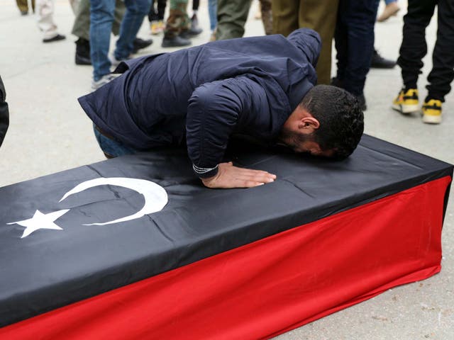 A Libyan man mourns during the funeral of people who were killed in an attack on a military academy in Tripoli, Libya January 5, 2020
