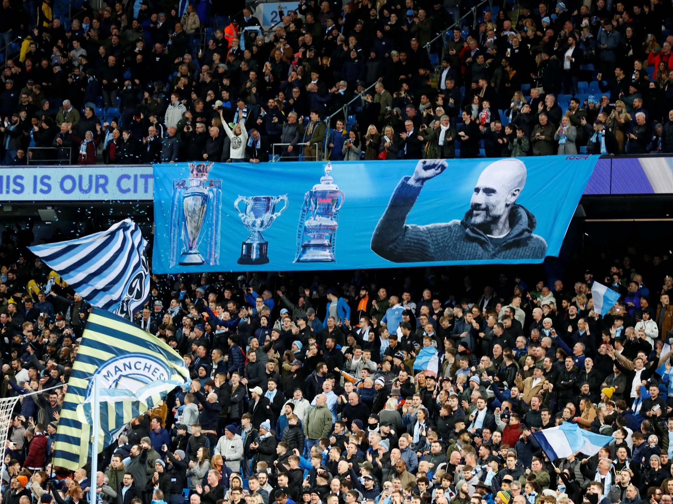 Manchester City supporters hang a banner of appreciation to Pep Guardiola