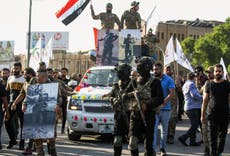 Iran-backed forces in Iraq warn of ‘sending US troops back in coffins’