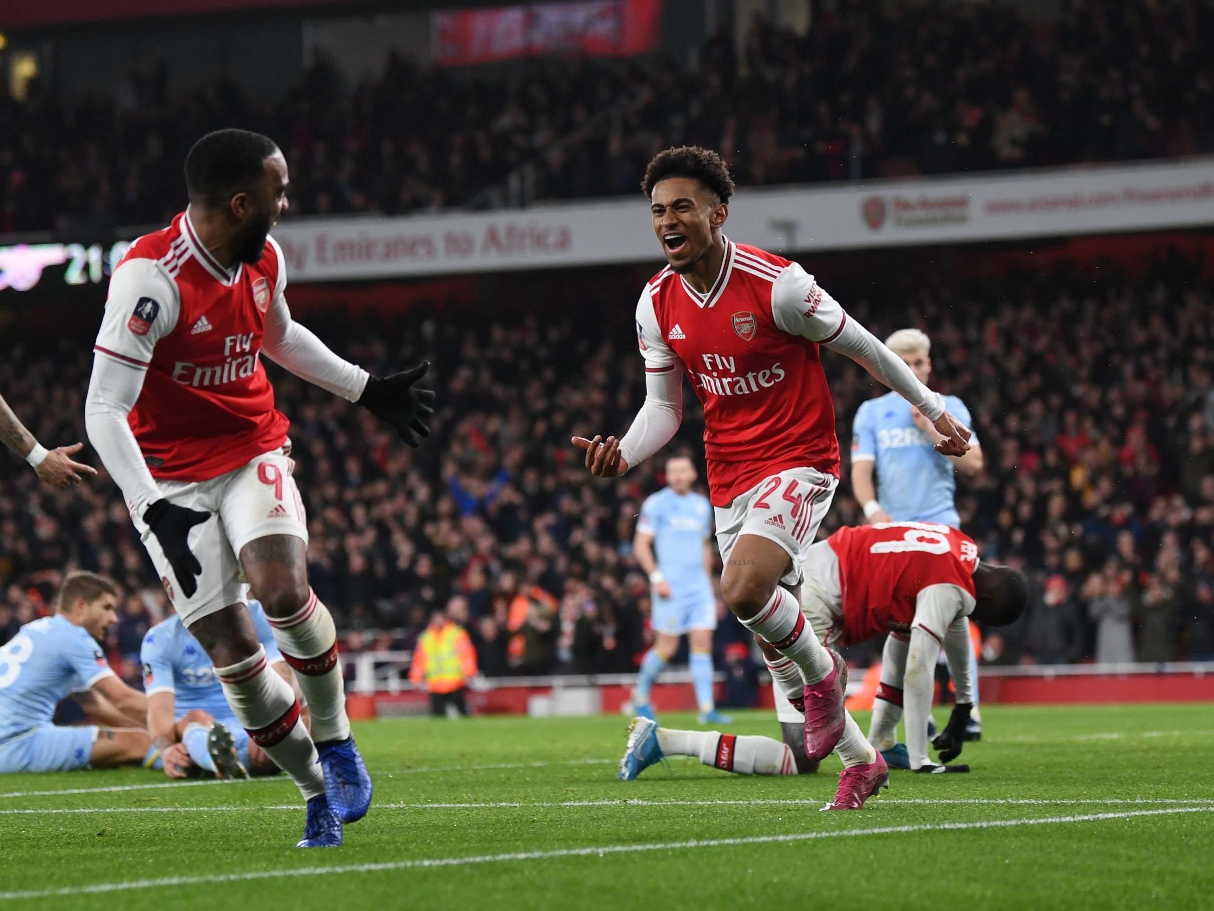 Reiss Nelson peels away to celebrate his second-half goal