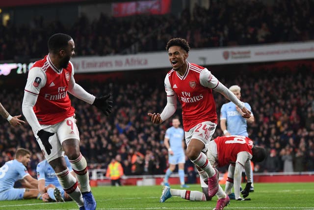 Reiss Nelson peels away to celebrate his second-half goal