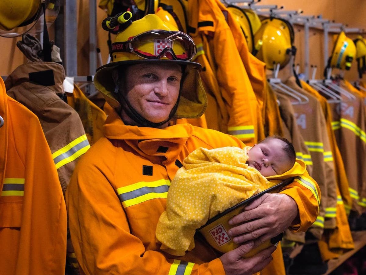 Australian wildfires: Photo of volunteer firefighter holding newborn son at fire station goes viral