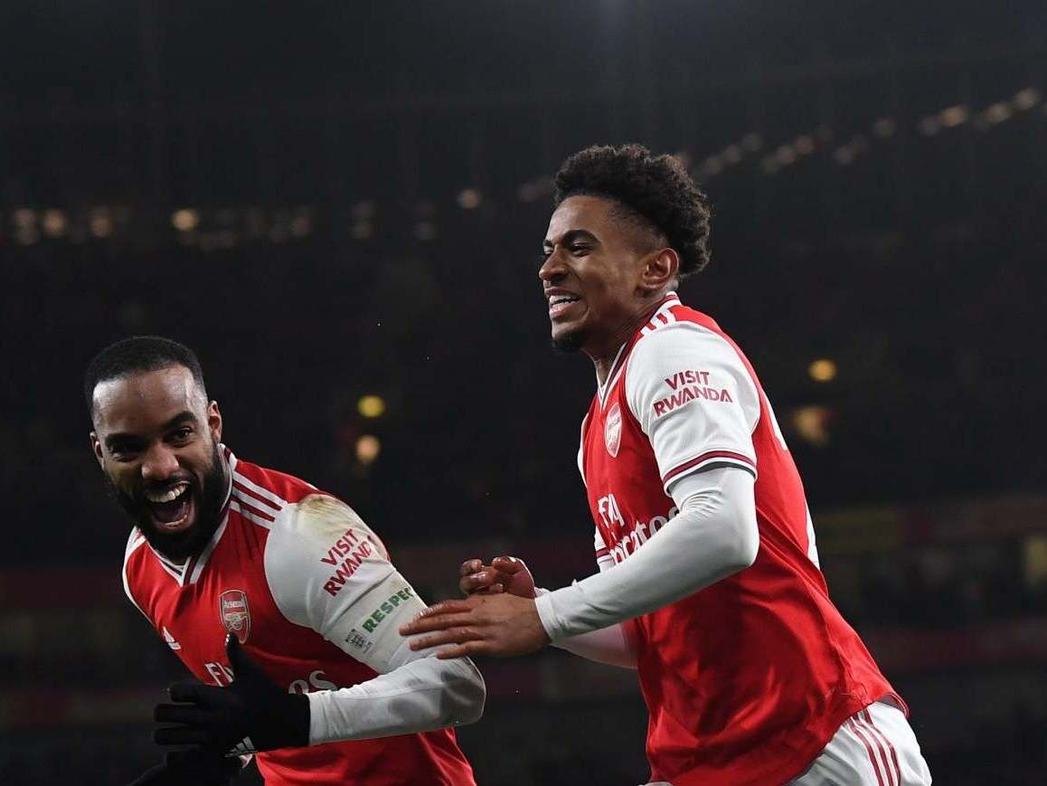 Reiss Nelson celebrates scoring a goal for Arsenal (Arsenal FC via Getty Images)