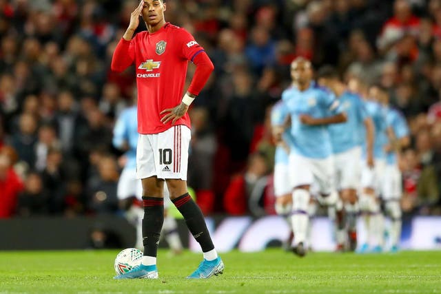 Marcus Rashford reacts after Manchester City's third goal