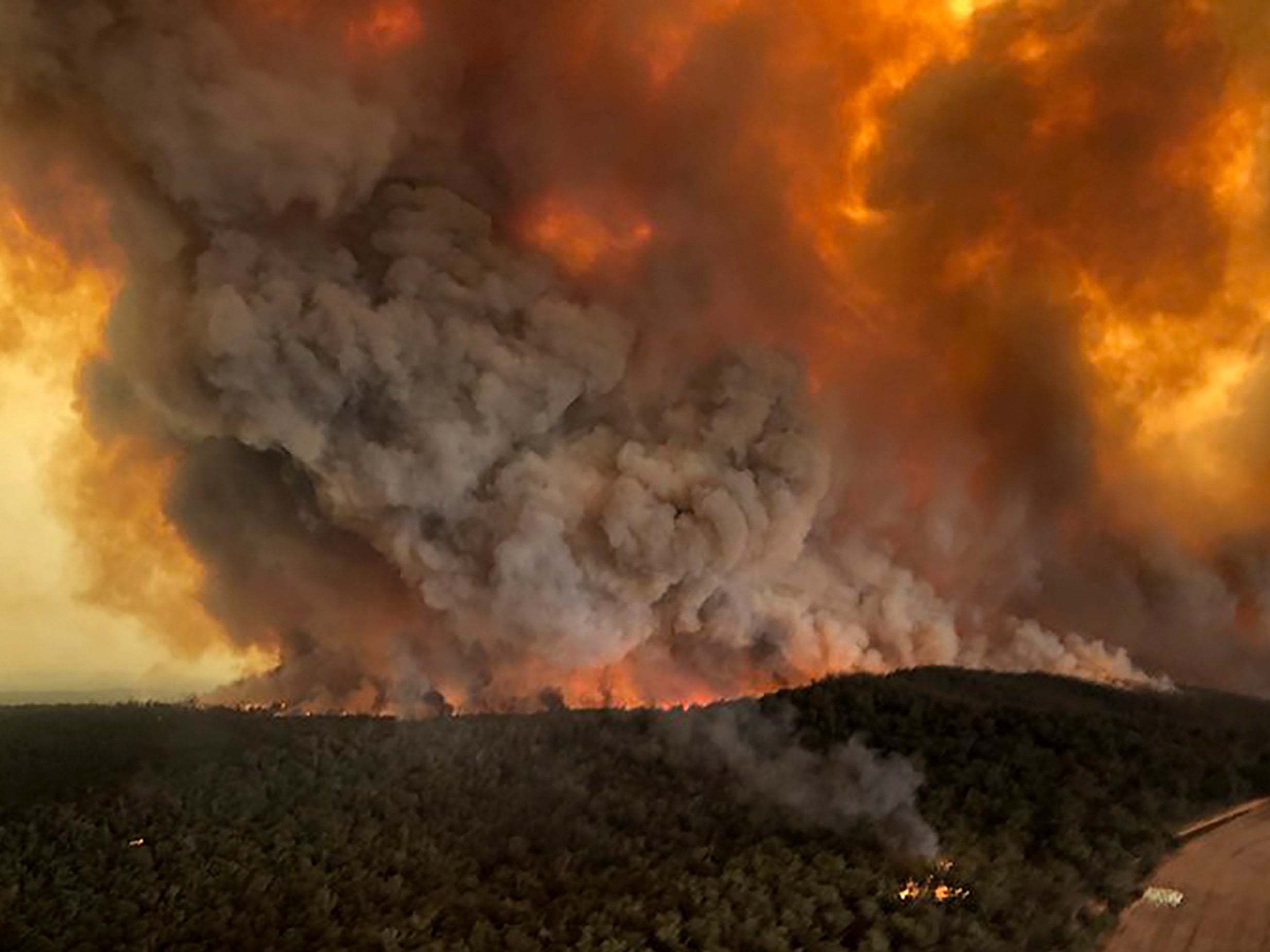 Wildfires rage under plumes of smoke in Bairnsdale, Australia, 30 December, 2019.