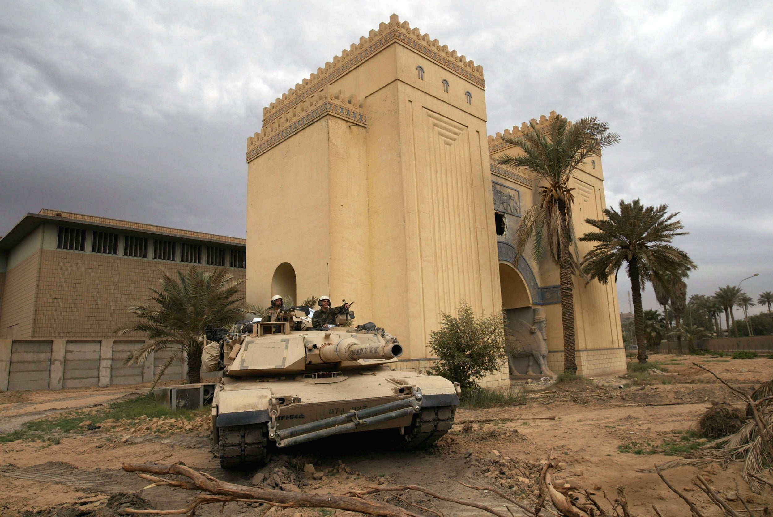 A US tank outside the plundered National Museum in Baghdad in 2003. US soldiers stood by as priceless treasures were looted