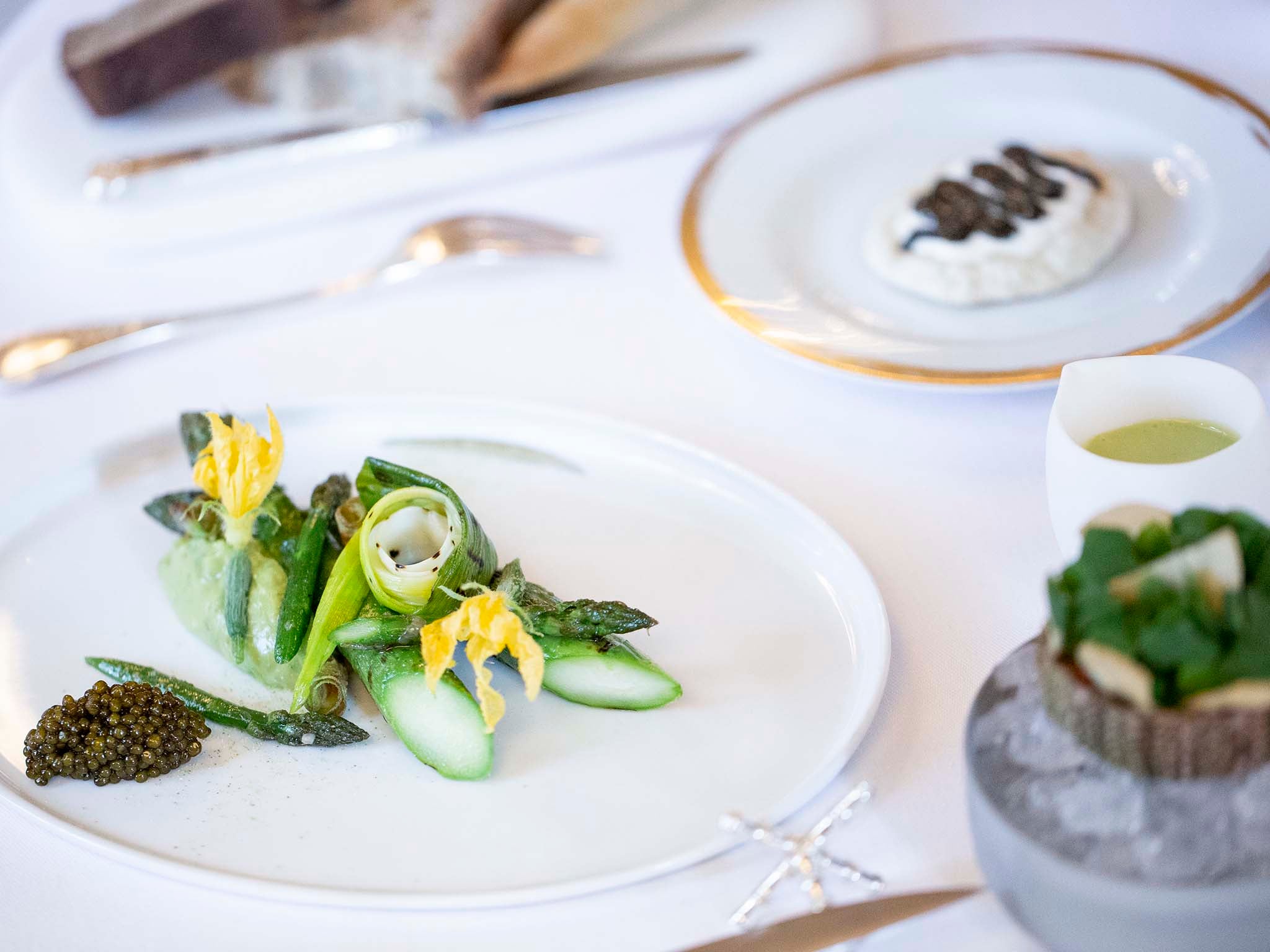 Starters include dishes like this asparagus with avocado and caviar (Pierre Monetta)