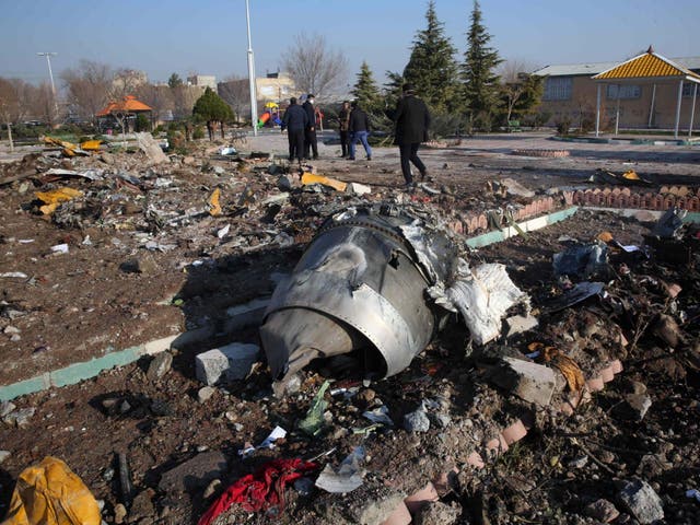Rescue teams work amid debris after a Ukrainian plane carrying 176 passengers crashed near Imam Khomeini airport in the Iranian capital Tehran on 8 January, 2020, killing everyone on board.