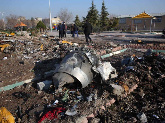 Rescue teams work amidst debris after a Ukrainian plane crashed near Imam Khomeini airport, Tehran