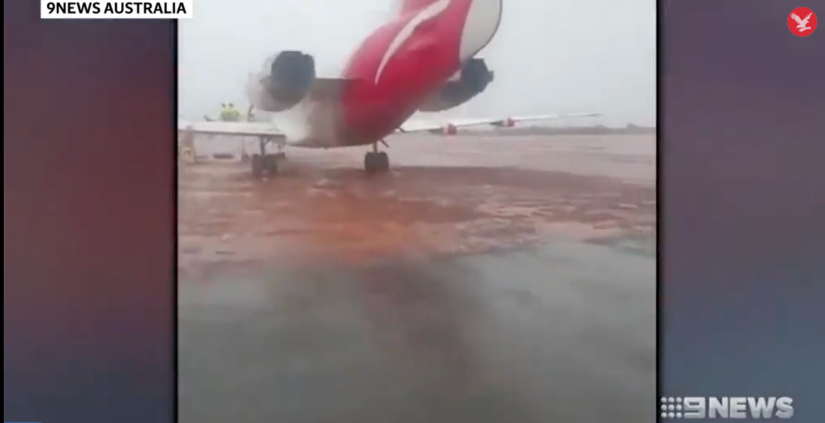 Qantas flight skids off runway and ends up stuck in mud | The ...