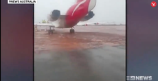 Qantas flight skids off runway and ends up stuck in mud