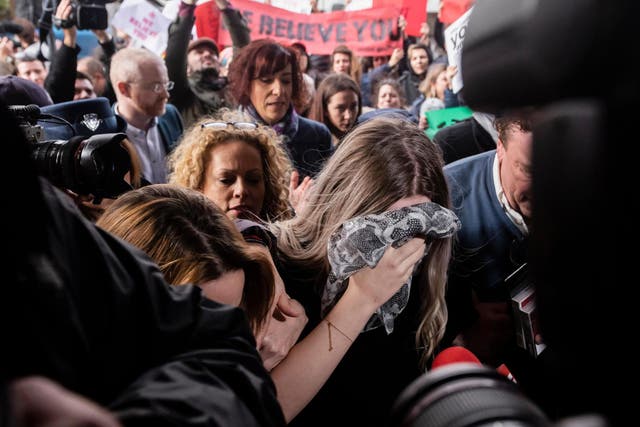 Teenager covers her face as she arrives at Famagusta District Court