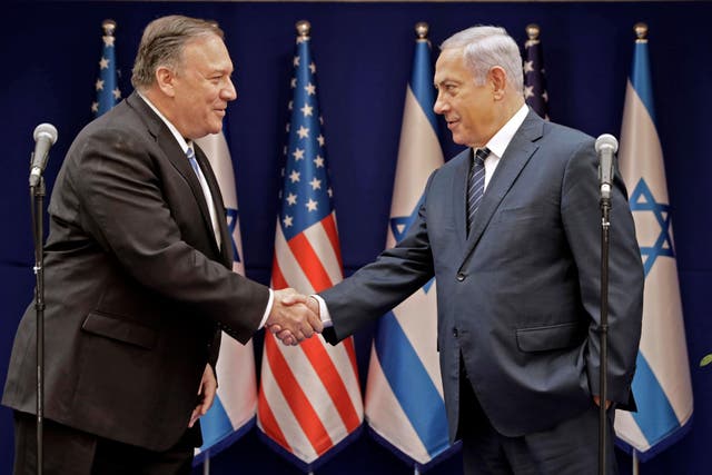 Israeli Prime Minister Benjamin Netanyahu shakes the hand of US Secretary of State Mike Pompeo following their meeting in Jerusalem on October 18, 2019