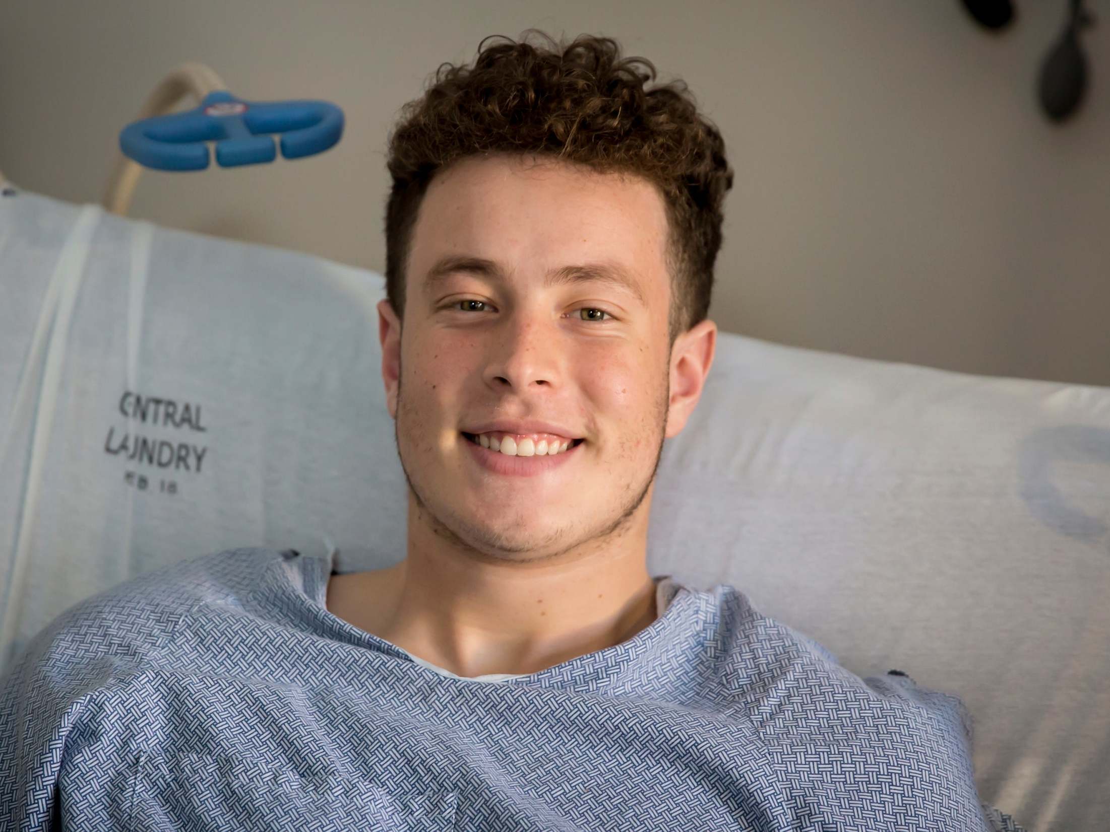 Nicolas Stacy-Alcantara, 17, tucked his arms and head inside his jacket to survive