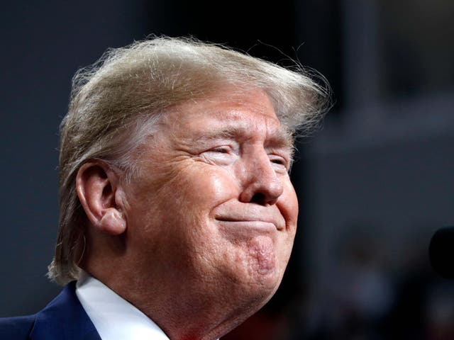 President Donald Trump smiles while speaking at a campaign rally in Ohio on Thursday