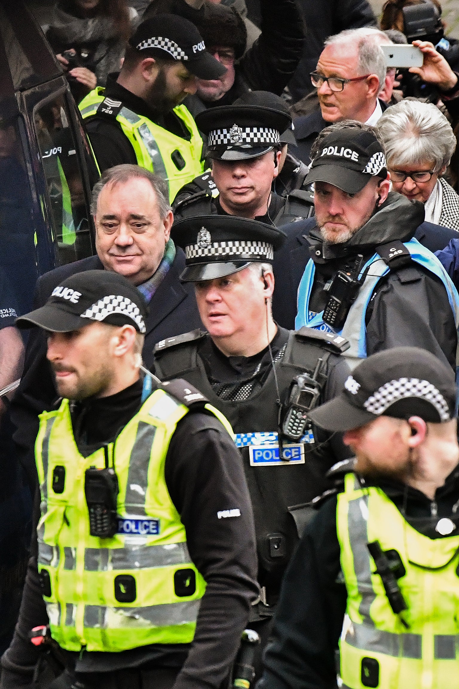 Alex Salmond, who will face trial this year for alleged sexual assault and rape, leaves court in November