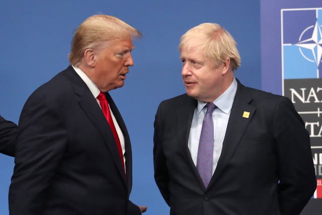 Trump and Johnson onstage during the annual Nato heads of government summit in Watford in December