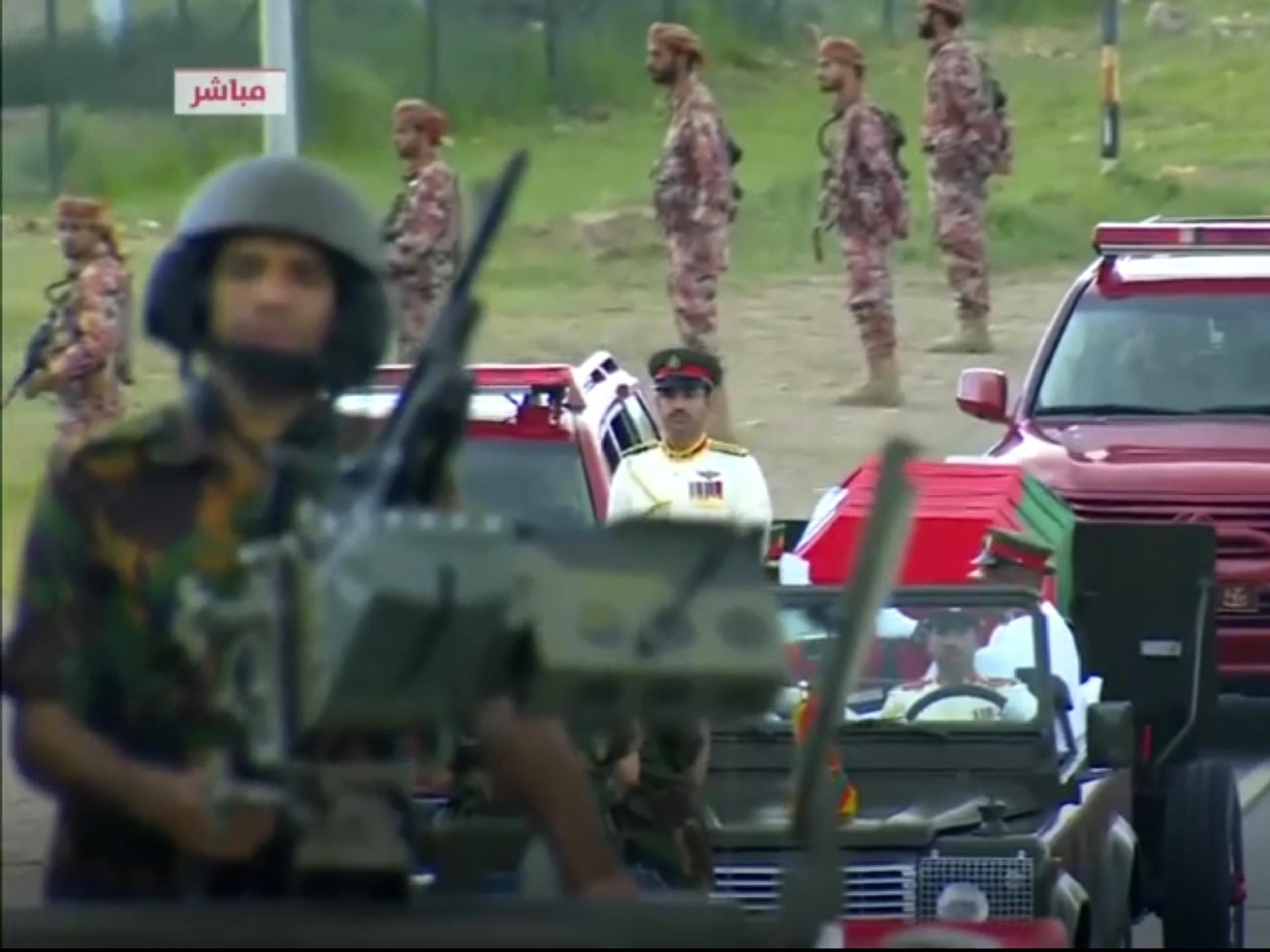 Soldiers guard the route of Qaboos’s coffin as it processes through the streets of Muscat, the capital of Oman