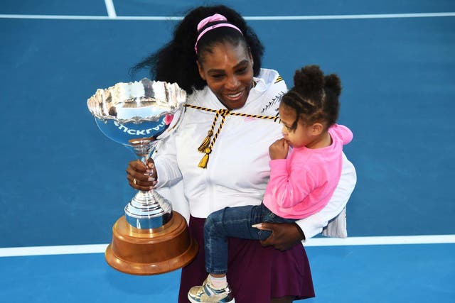 Serena Williams celebrates on court with her daughter, Alexis Olympia Ohanian Jr