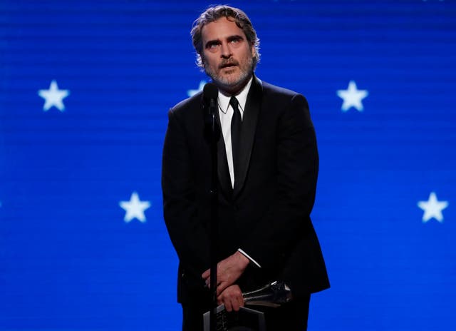Joaquin Phoenix accepts the award for Best Actor at the Critics' Choice Awards