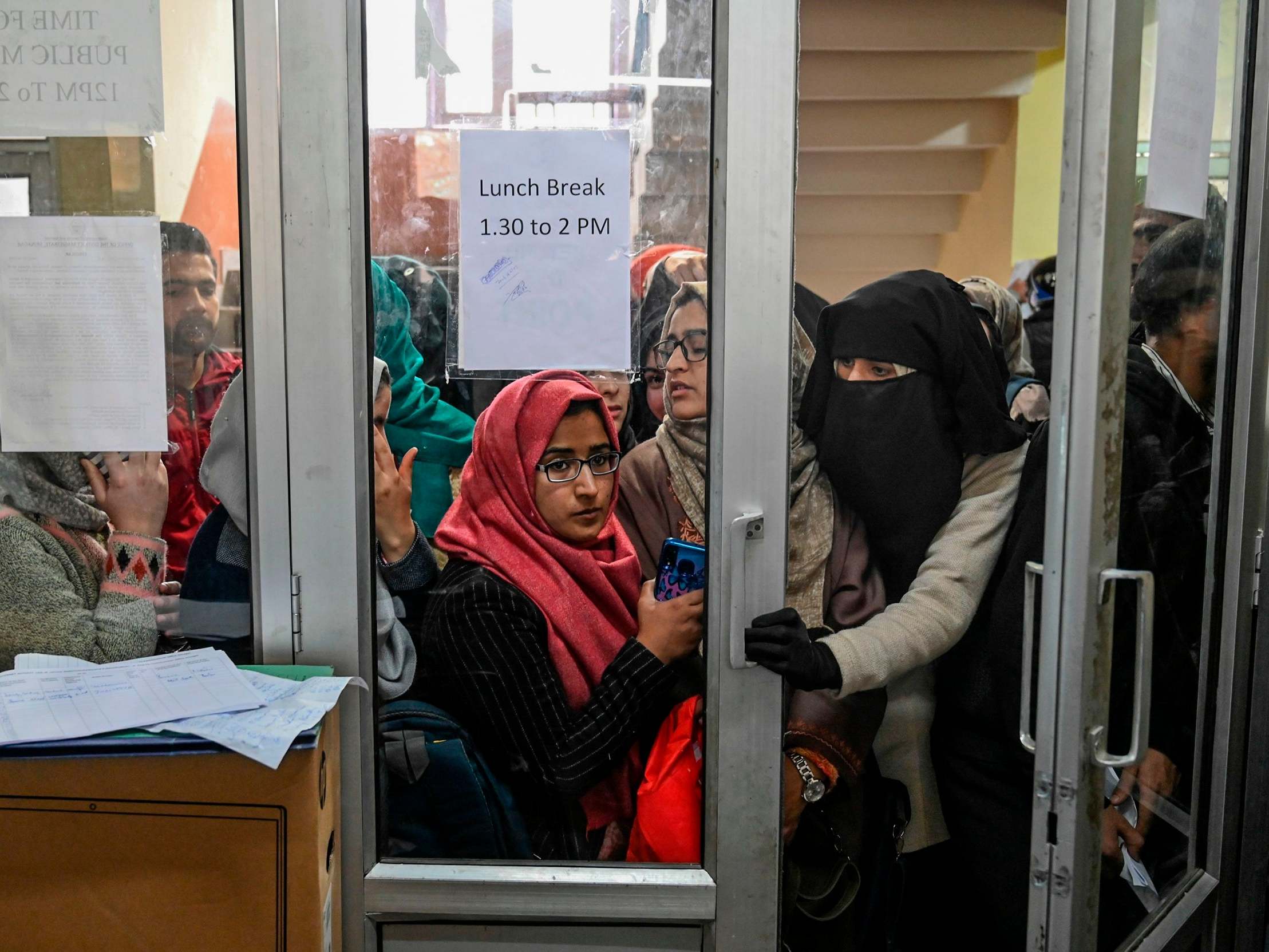 Students wait for their turn to get online in Srinagar