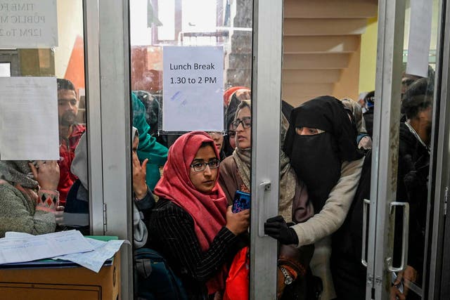 Kashmiri students wait for their turn to use the internet at the divisional commissioner’s office in Srinagar