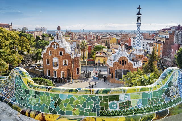 A view from the main terrace of the two gatehouses either side of Güell Park’s entrance