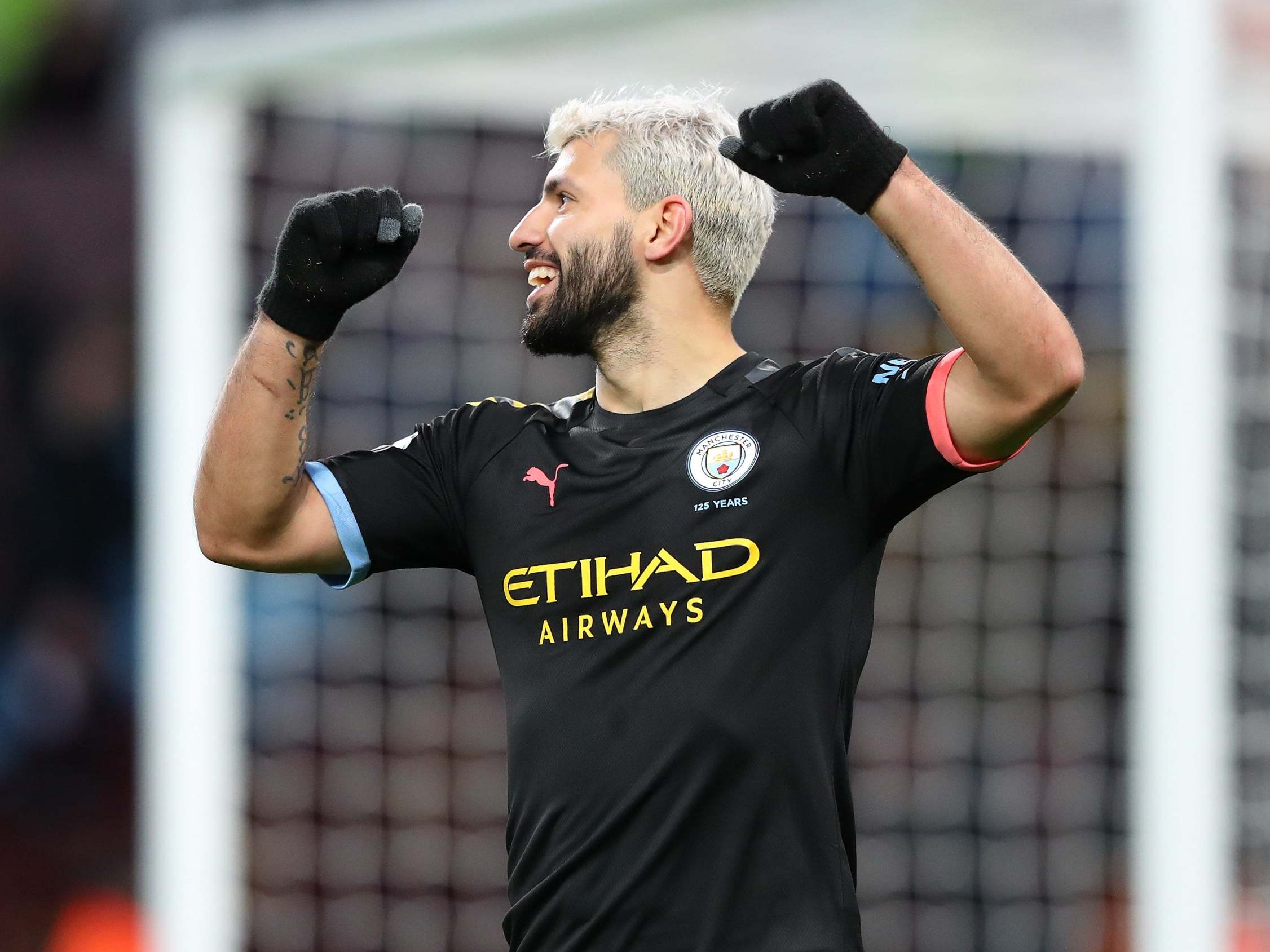 Sergio Aguero celebrates completing his hat-trick against Aston Villa