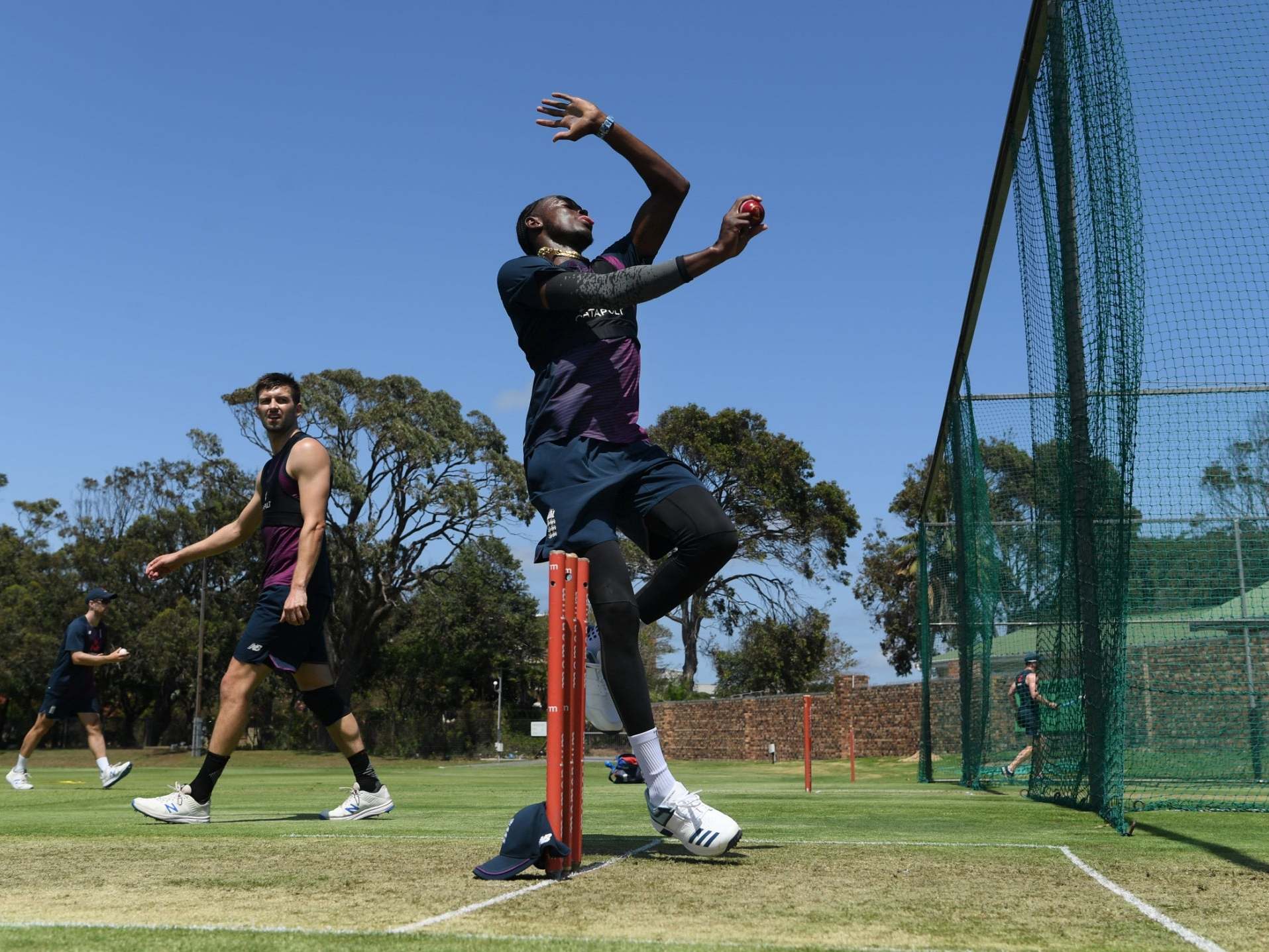 Jofra Archer in the nets at St George's Park as Mark Wood looks on