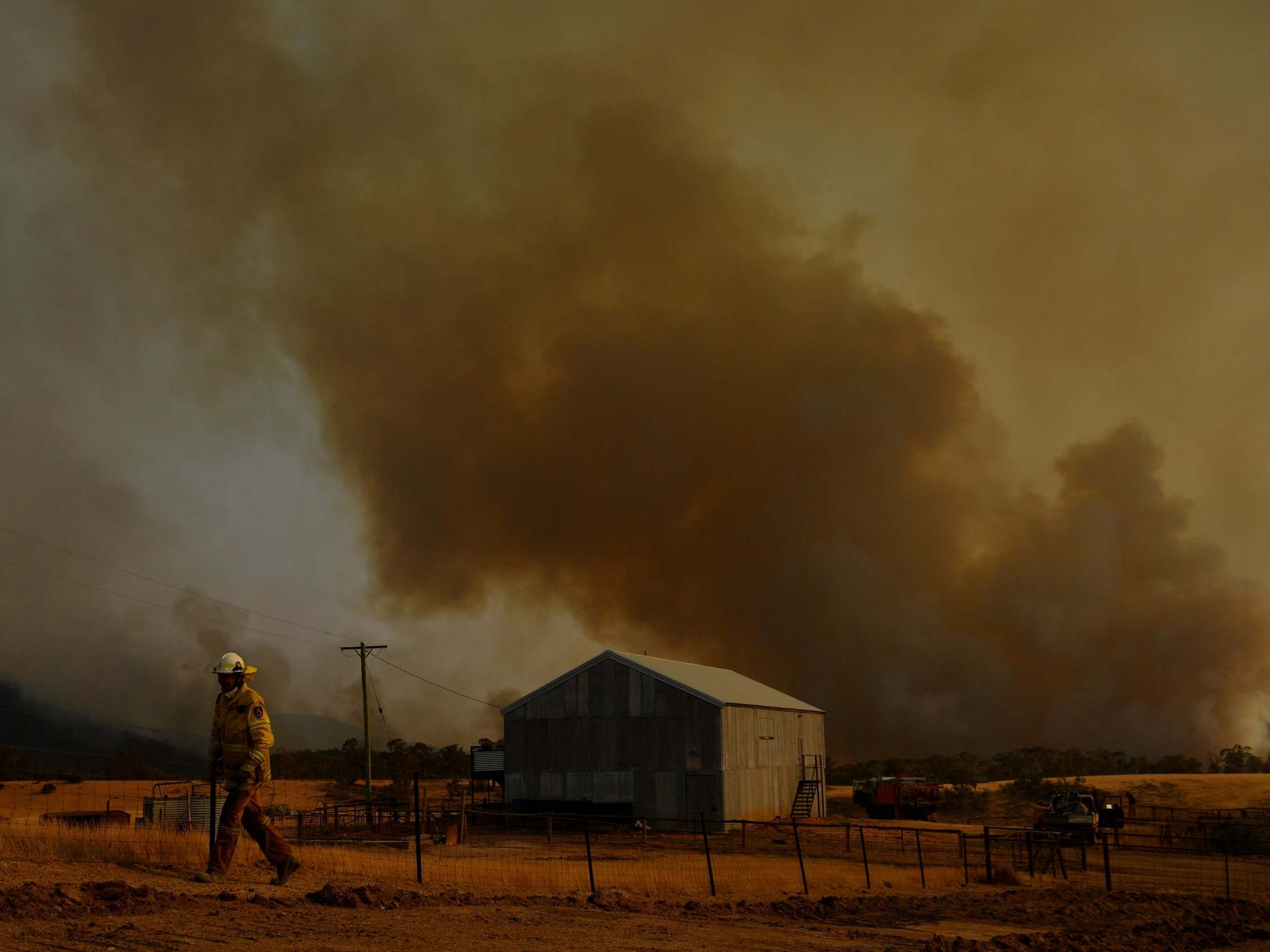 Smoke rises from a fire in Tumburumba, Australia, where bush blazes have been raging across the country