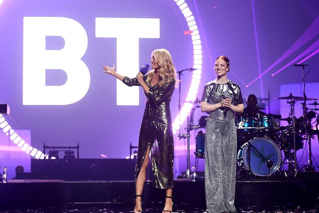 Tess Daly on stage with Jess Glynne, as she stars in a record-breaking drone display to celebrate BT's new brand purpose 'Beyond Limits' at Wembley Arena on October 17, 2019 in London, England