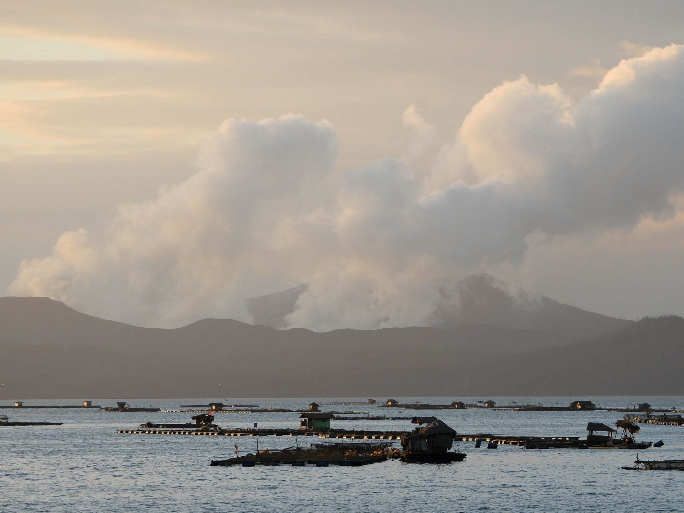 Taal volcano news &ndash; live: Tens of thousands flee danger zone amid fears of imminent 'explosive eruption' as towns cloaked in ash