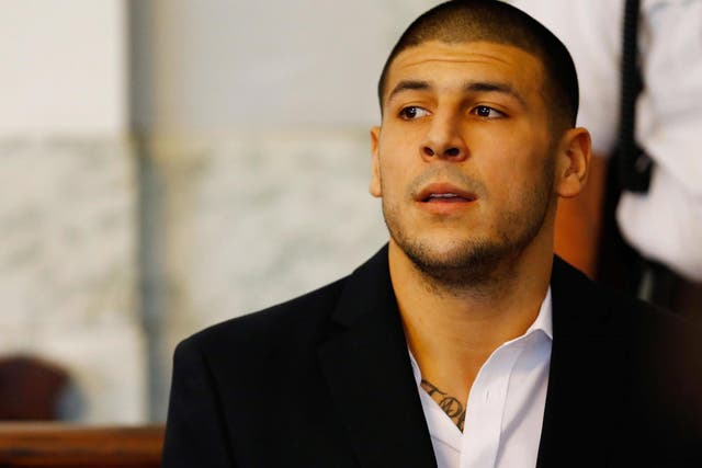 Aaron Hernandez sits in the courtroom of the Attleboro District Court during his hearing on 22 August 2013 in North Attleboro, Massachusetts.