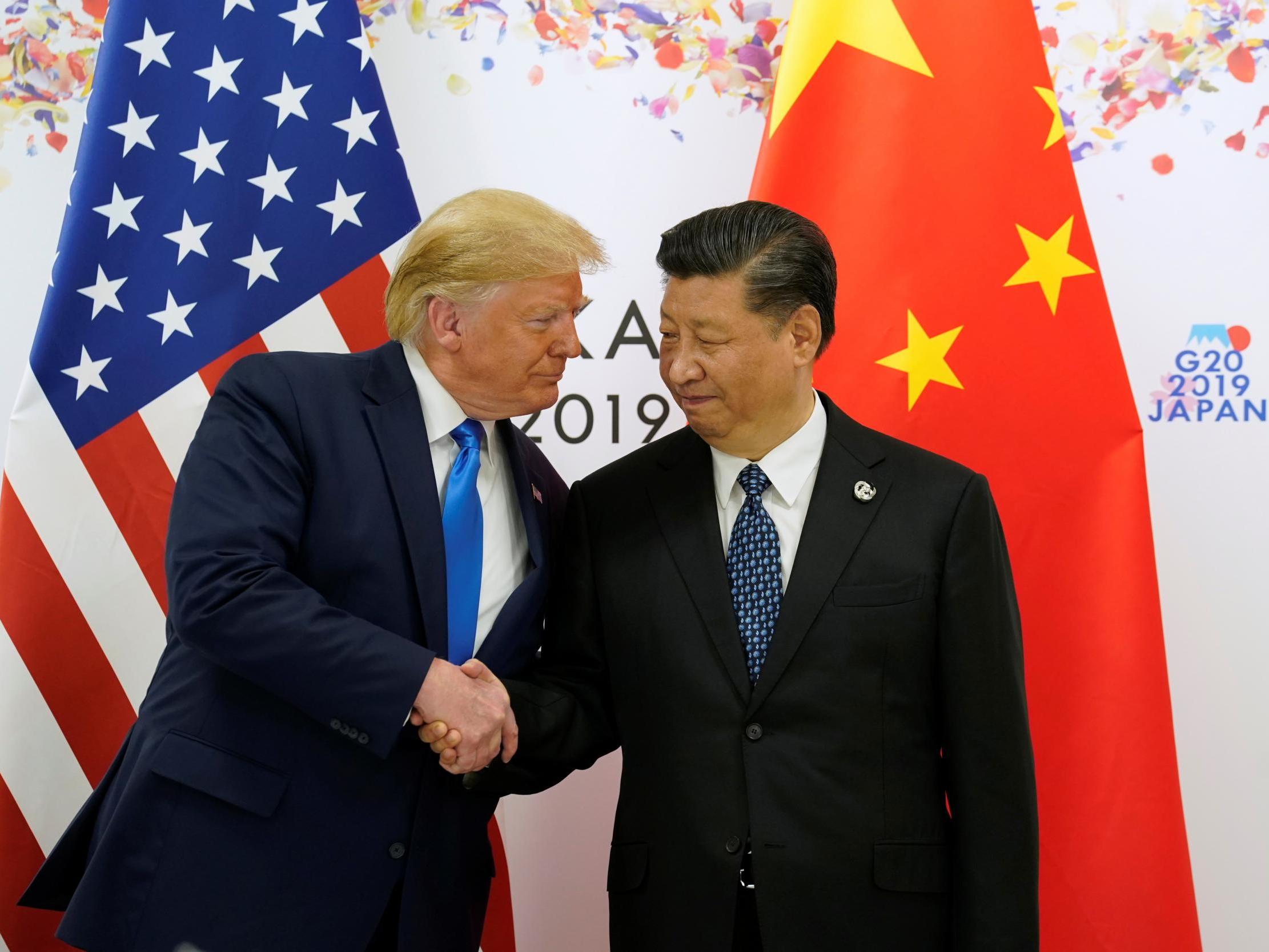 Donald Trump shakes hands with China's President Xi Jinping before starting their bilateral meeting during the G20 leaders summit in Osaka, Japan in June 2019
