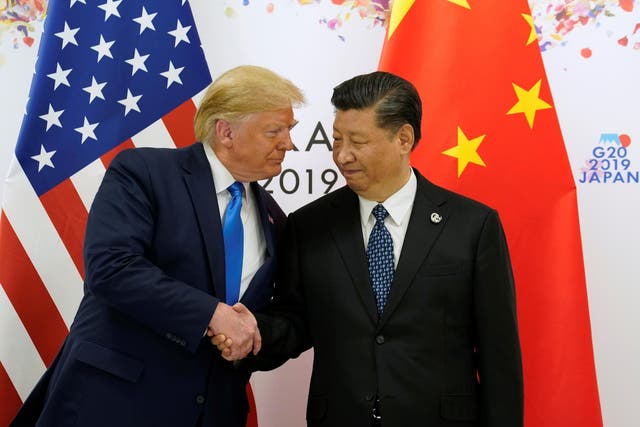 Donald Trump shakes hands with China's President Xi Jinping before starting their bilateral meeting during the G20 leaders summit in Osaka, Japan in June 2019
