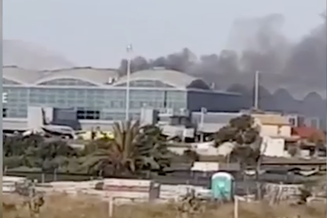 Alicante airport remains shut after a fire broke out on the terminal roof