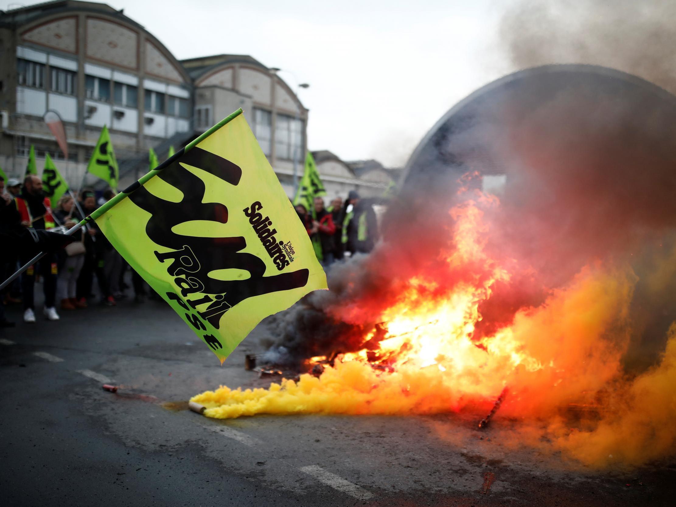 A sud rail flag and fire at a French labour union strike near to Gare e Lyon train station January 9, 2020. Benoit Tessier/Reuters