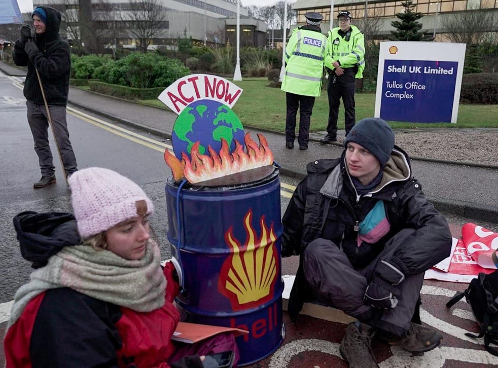 Activists outside Shell HQ in Scotland say the company's success means a bleak future for the environment