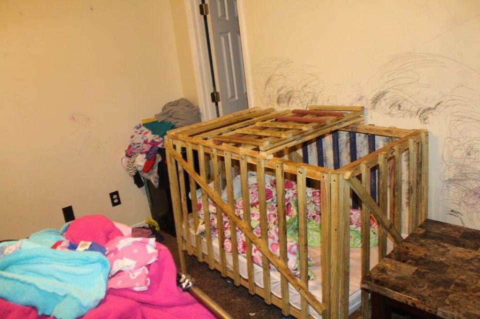 Investigators with the Lee County Sheriff's Office in Alabama say five children were kept in 'cages' inside a home in Smiths Station outside Columbia