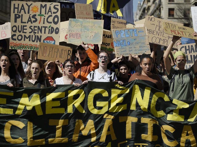 Students demonstrate behind a banner reading "Climate emergency" on March 15 2019