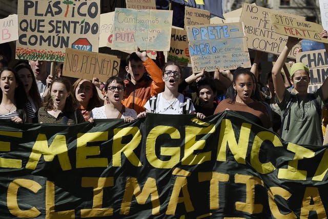 Students demonstrate behind a banner reading "Climate emergency" on March 15 2019