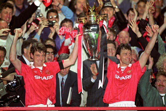 Steve Bruce and Bryan Robson celebrate winning the Premier League title in 1993