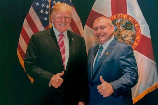 Image released by House Judiciary Committee in the impeachment probe shows a photo of Lev Parnas with Mr Trump in Florida