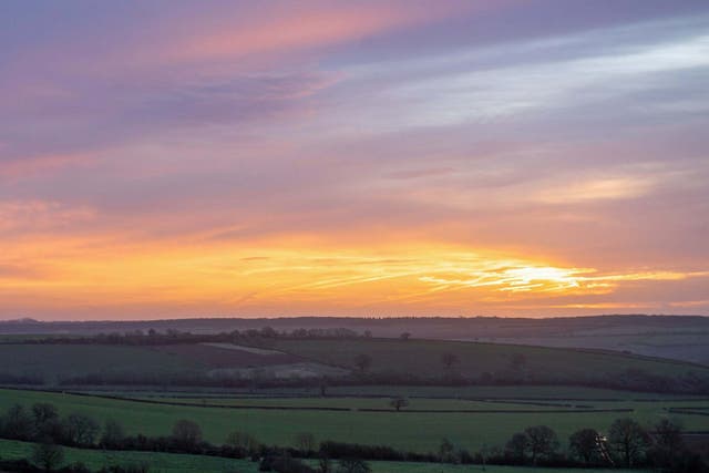 Winter sun rises over fields near Morcott in Rutland