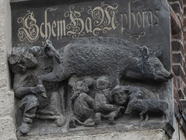 Sculpture depicts Jewish people sucking on the teats of a pig
